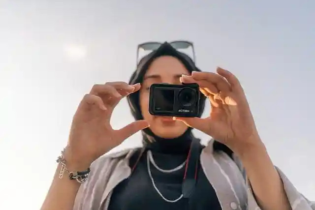 It's a cover page of content creation; a girl take camera, best seo expert in alappuzha